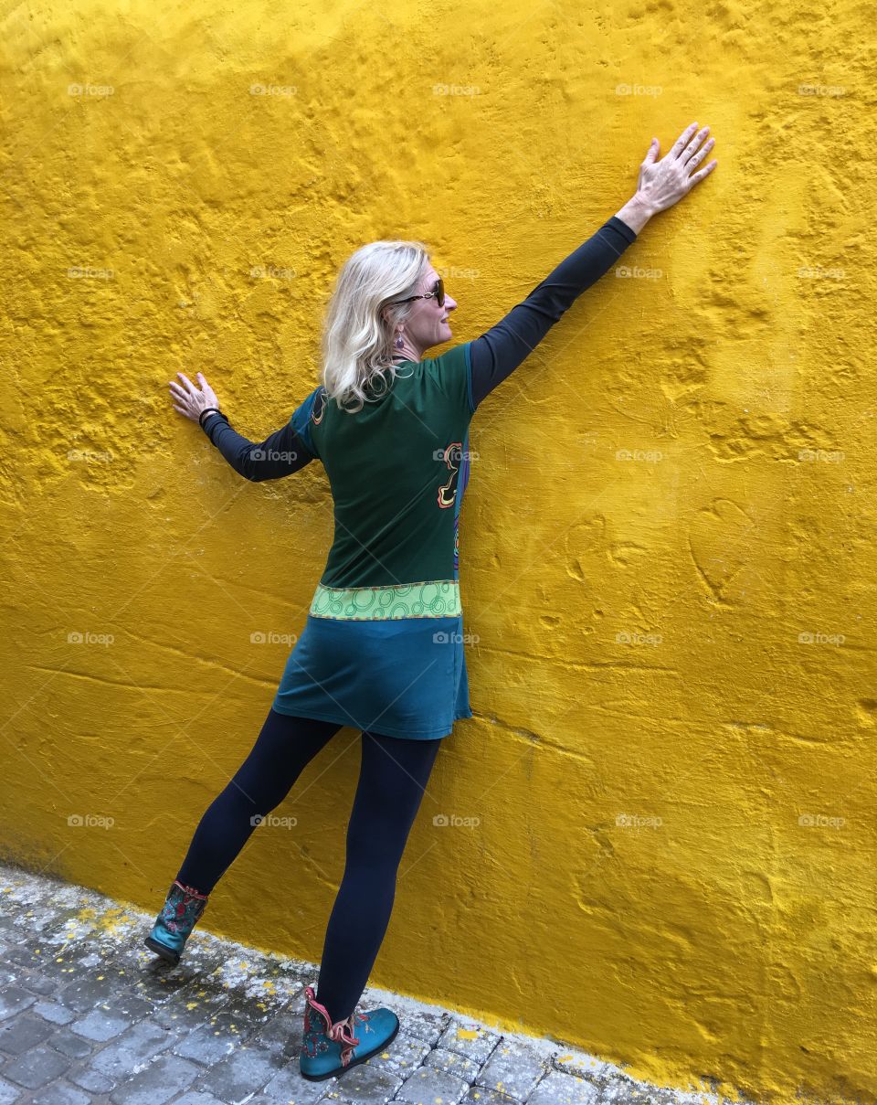 Model on yellow wall