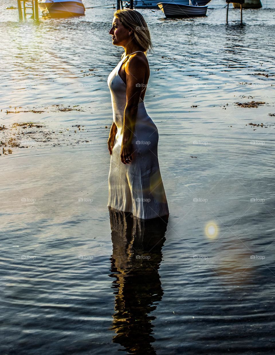 beautiful woman into the sea at the beach ,a springtime day. 
❤️🧡💛💚💙💜❤️🧡💛💚💙