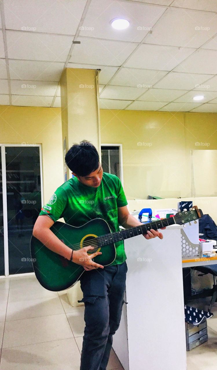 Trying to play a guitar with my favorite song