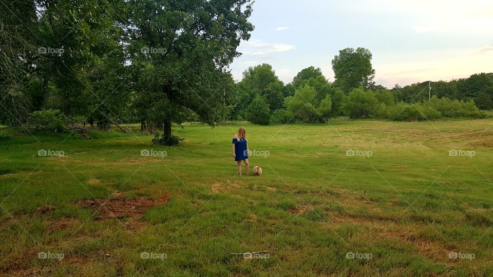 blonde girl and dog in the county