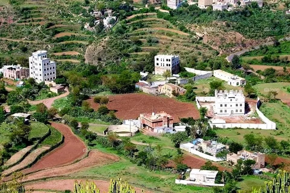 A stunning view of green mountains covered in fog in Yemen