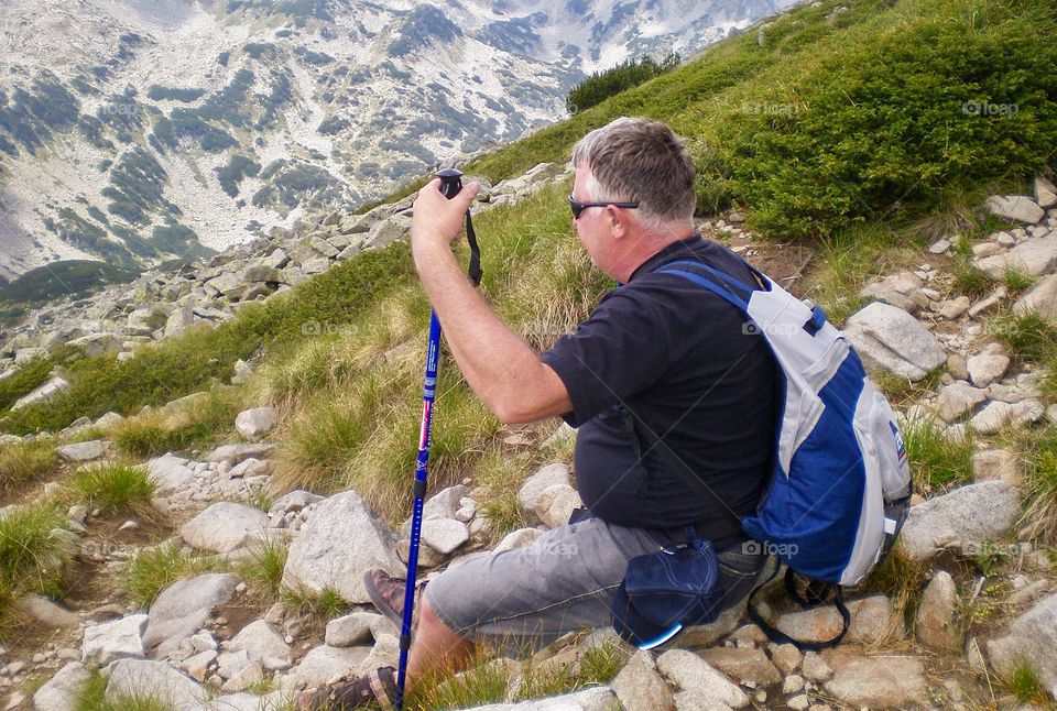 Man enjoys the view in the mountain