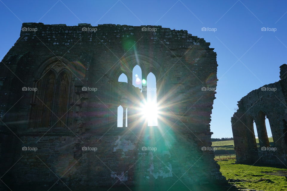 Egglescliffe Abbey Sunset ... dining brightly through what was once a stained glass window .. not sure if good sunsets show all the brightly coloured blobs of light or not ?!?!