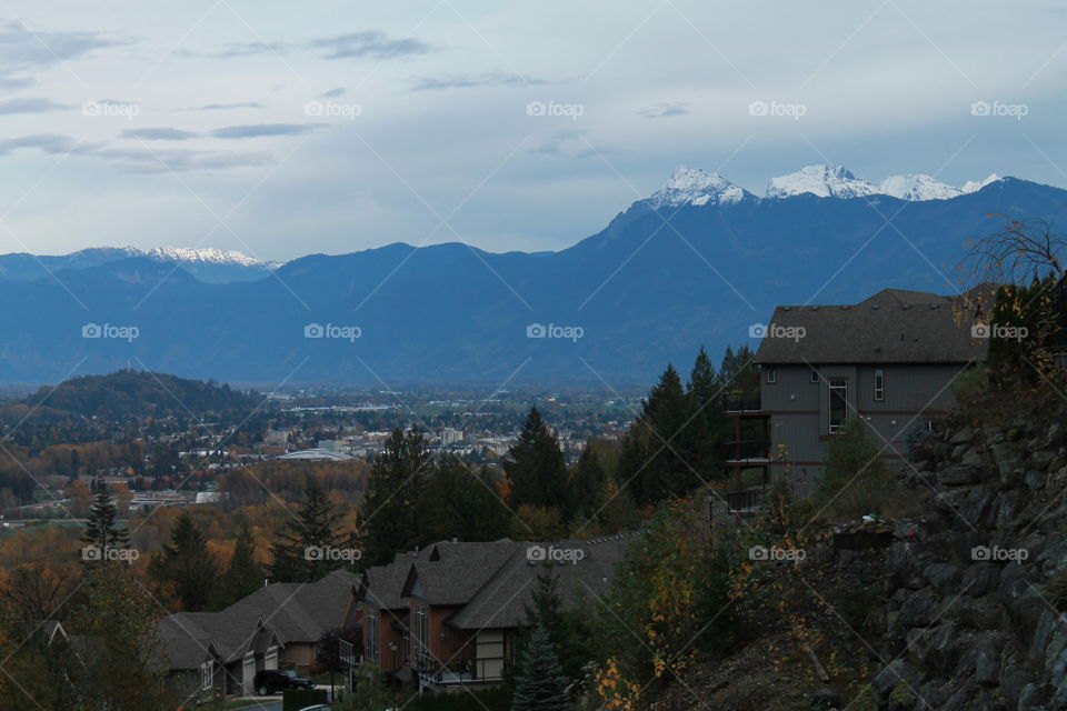 The view from the balcony over looking the sleepy town of chilliwack and the mountains behind it.