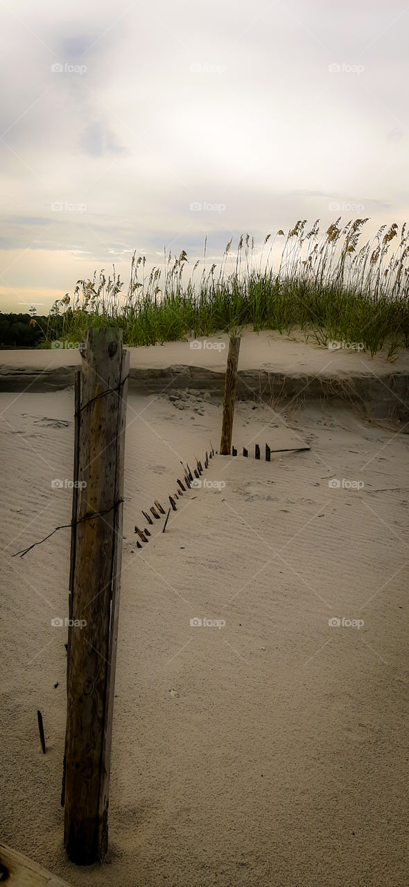 damaged fence by tropical storm