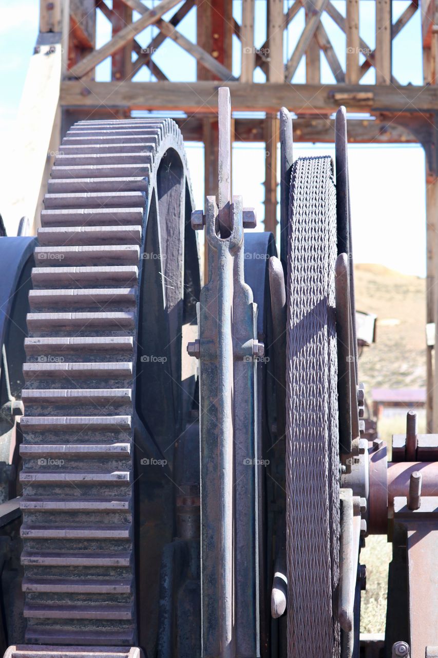 Antique mining equipment outdoors wheel and cogs 