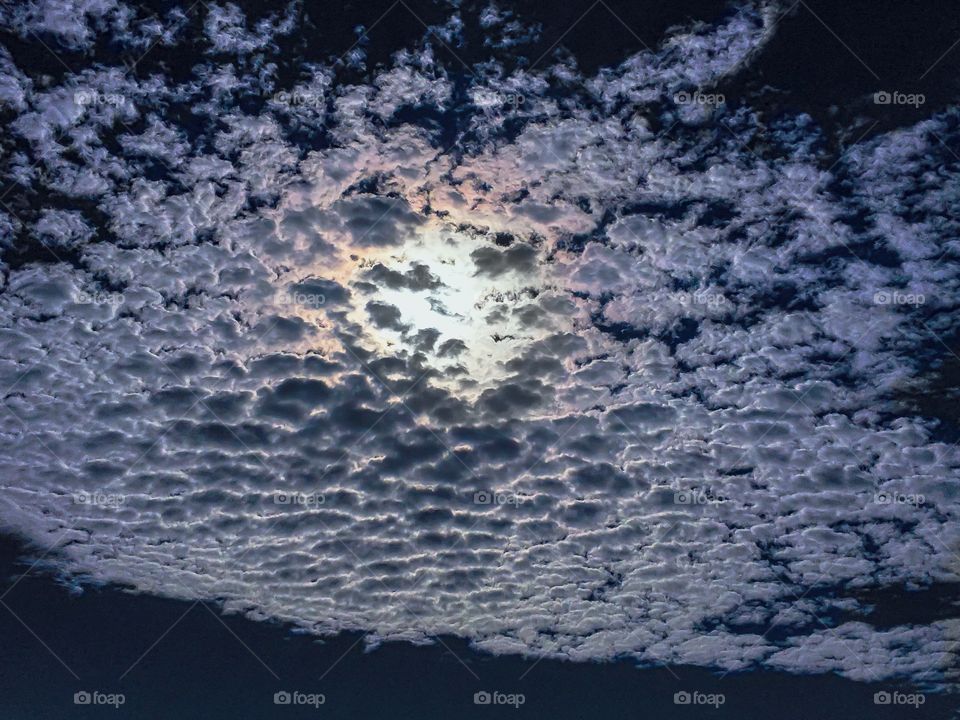 Full moon behind cirrus clouds on the Atlantic Coast