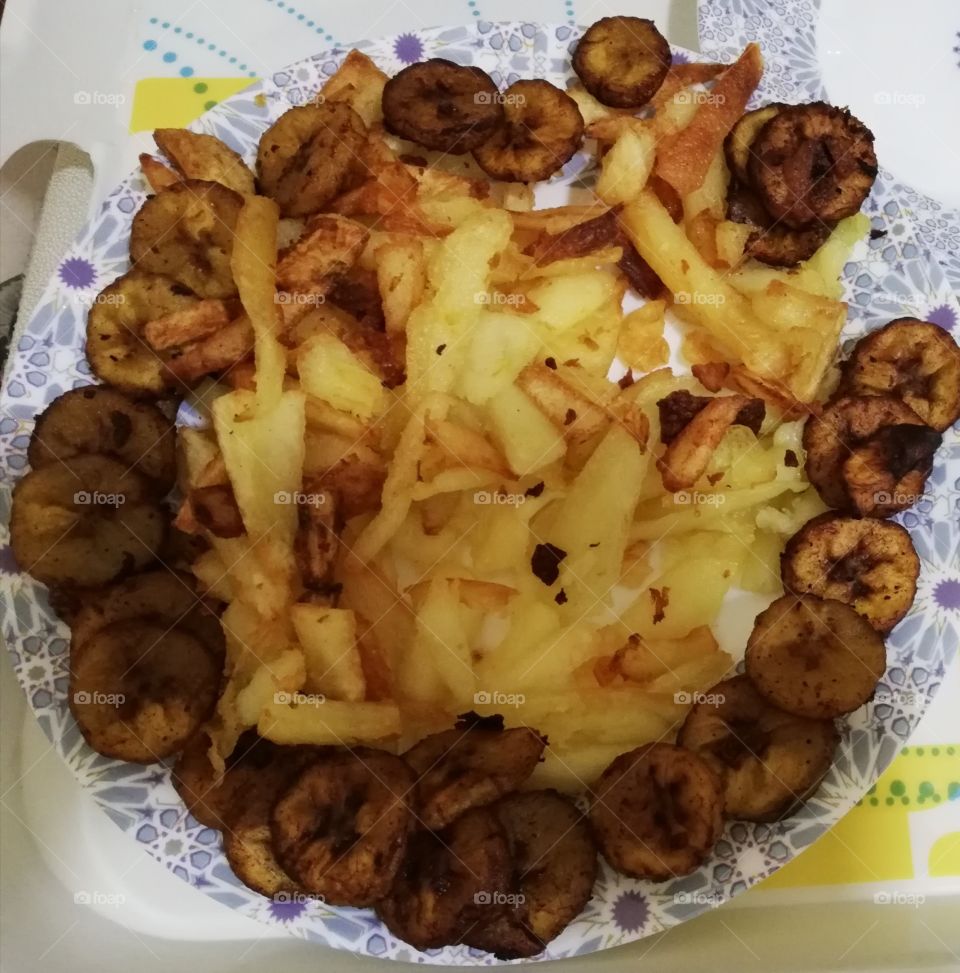 Home made potato fries & plantain - food