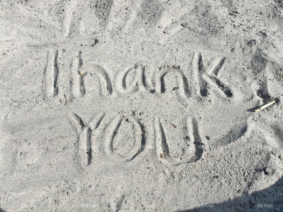 Thank you in the sand