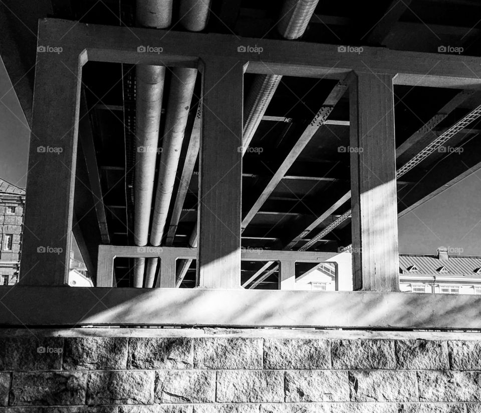 Black and white under a bridge 