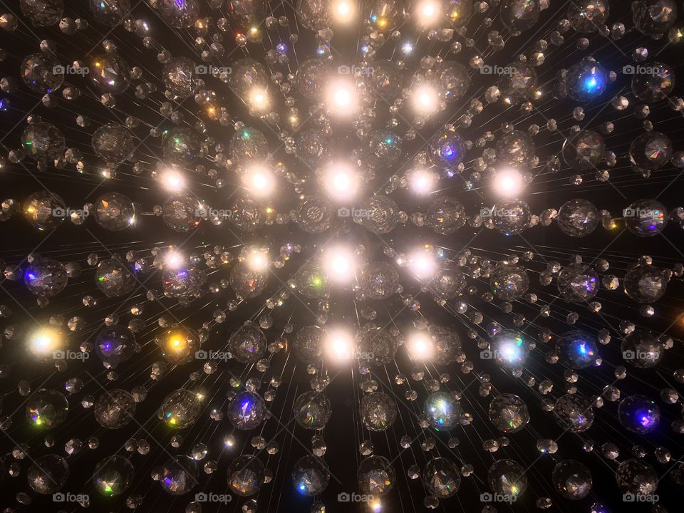Sparkling crystal chandelier in the lobby of the Montcalm Hotel, Marble Arch, London. Visited in Autumn. Looking up from directly underneath.