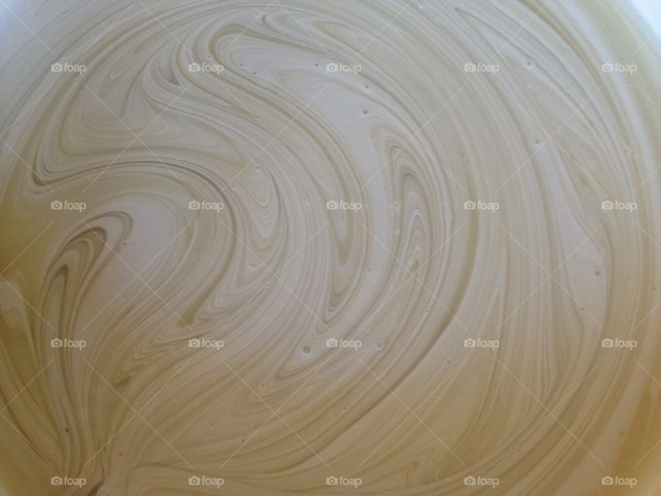 Paint swirling . A 5 gallon bucket of paint