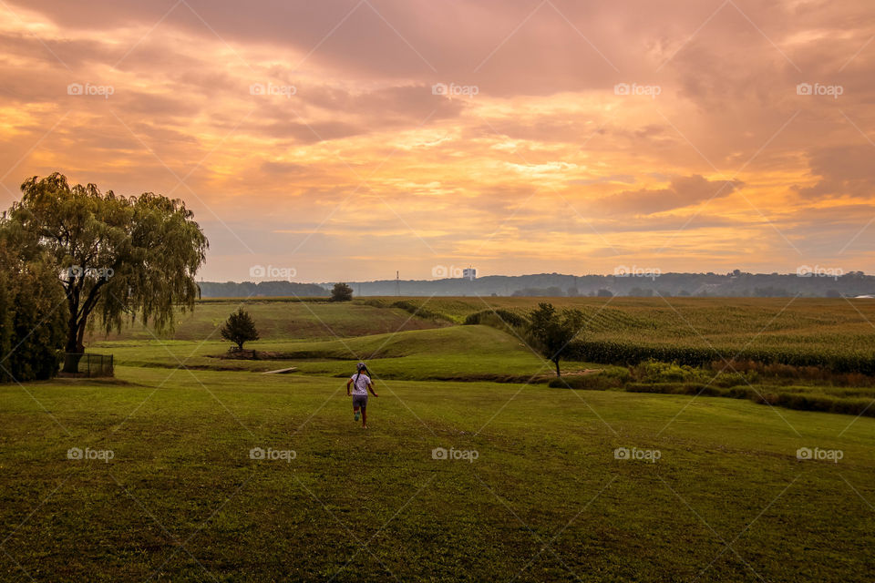 Child is running towards the sun