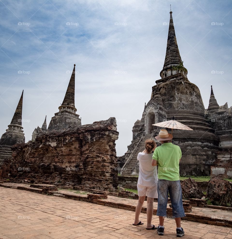 Tourists take The three King’s pagoda photo at Wat Phra Si Sanphet Ayuthaya Thailand , it was the grandest and most beautiful temple in the capital and it served as a model for Wat Phra Kaew in Bangkok.