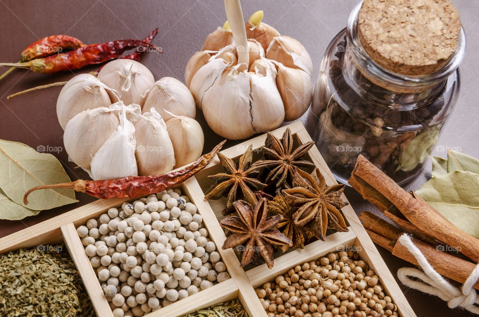 Asian spices placed in a wooden box 