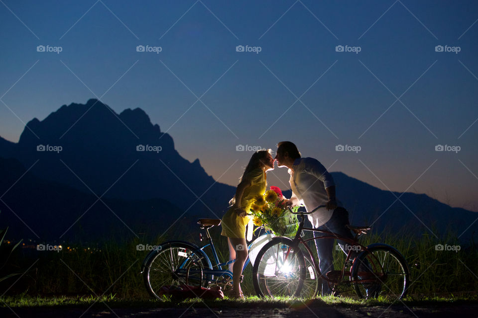 Couple kissing on a bike ride day. Bikes and couple kissing lovely