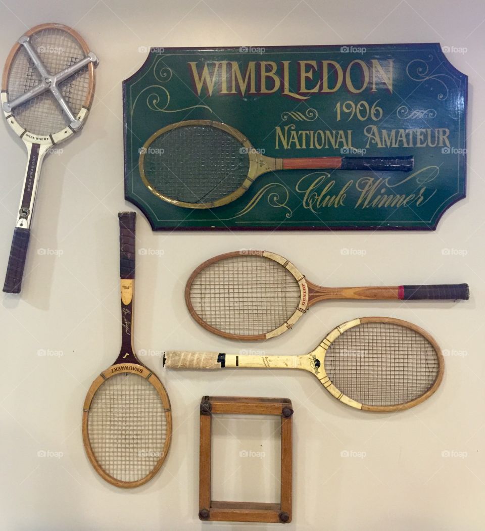 Vintage tennis bats on display 