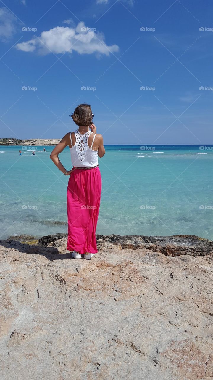 Summer time, summer outfit, summer mood, summer clothes. Seashore. Amazing summer weather. Woman in beautiful summer outfit. 