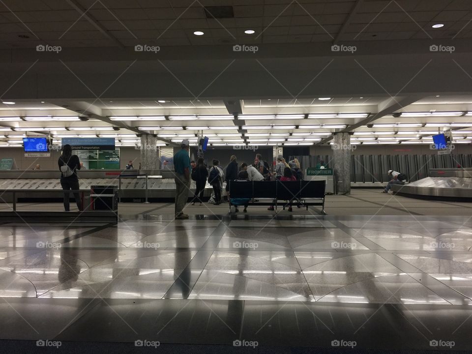 Shadows at baggage claim