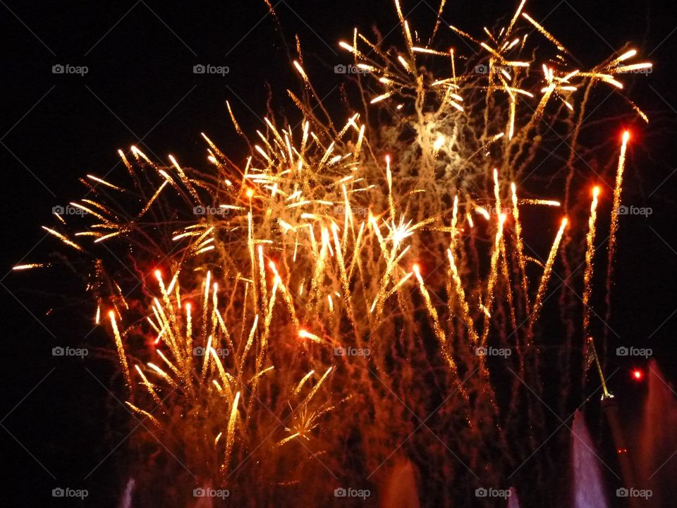 Close-up of lit sparkler at night