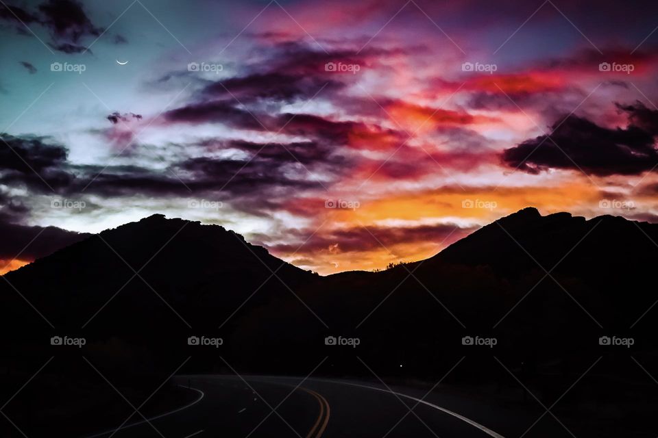 colorful vibrant mix of colors clouds skyline mountains moon road dark cloudy mother nature outdoors beautiful Colorado Photo photography pictures cloudscape wanderlust sunrise sunset saturation tones Powerful extreme dramatic drama weather sky 