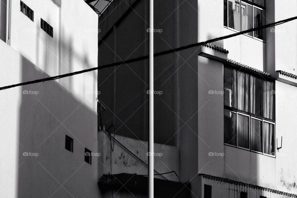 Close up of building with windows in black and white