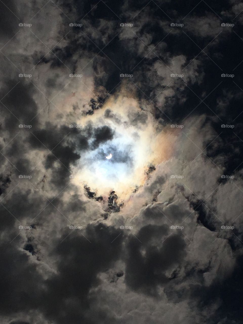 Eclipse through the clouds