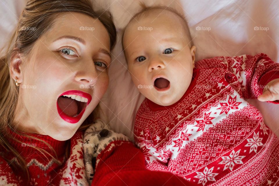 Mother and baby girl making selfie 