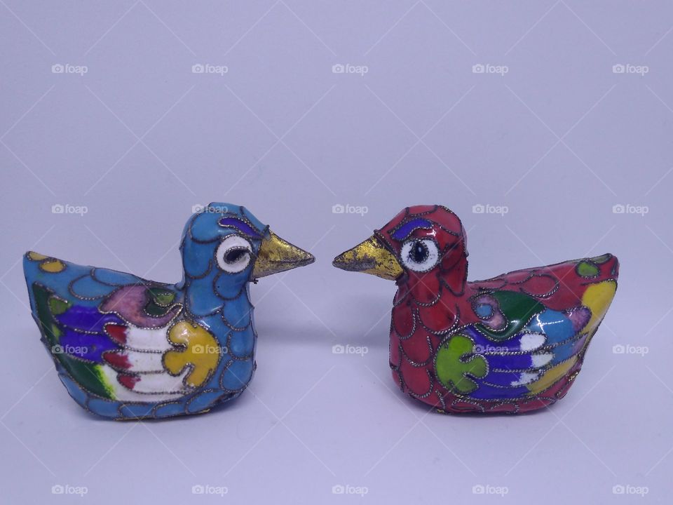 Duck figurines with floral pattern