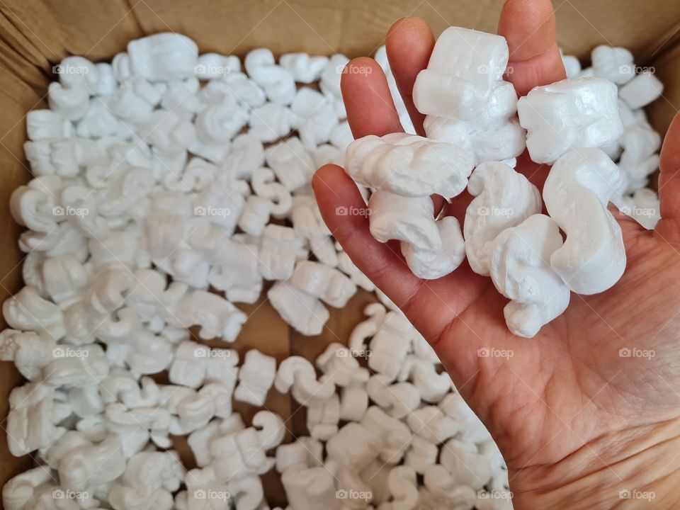 expanded polystyrene chips for shipping in hand