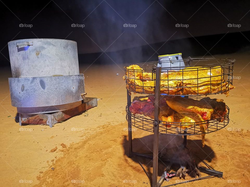 One way to grill meat in cases to the desert
