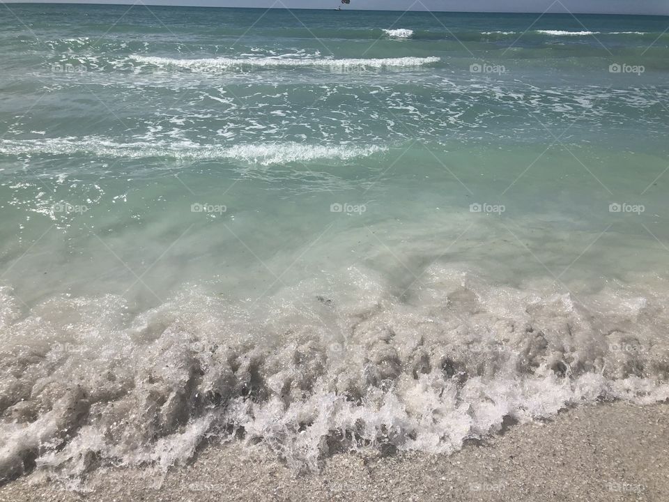 Turquoise waves of the gulf shore