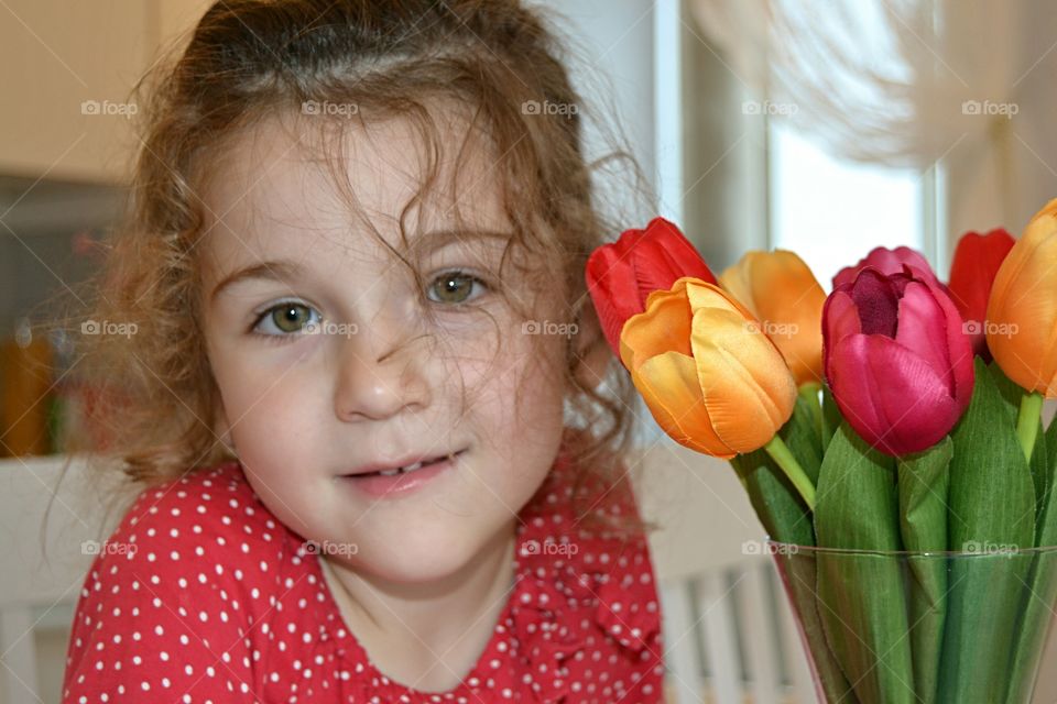 Close-up of girl holding tulip