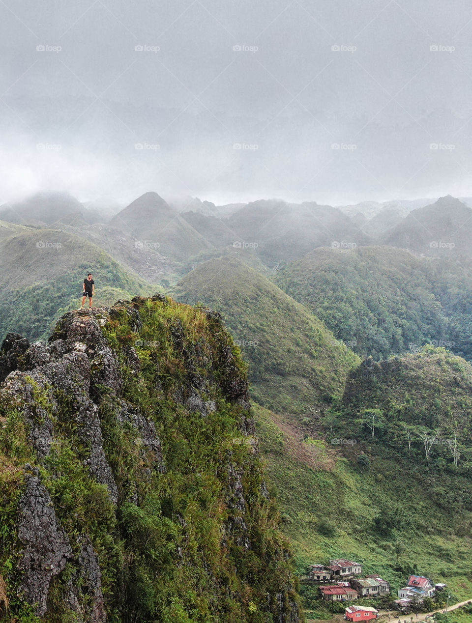 Impressive peak view on Lugsangan Peak or sometimes called Casino Peak at a cloudy, rainy and foggy day in Southern Cebu (Philippines)