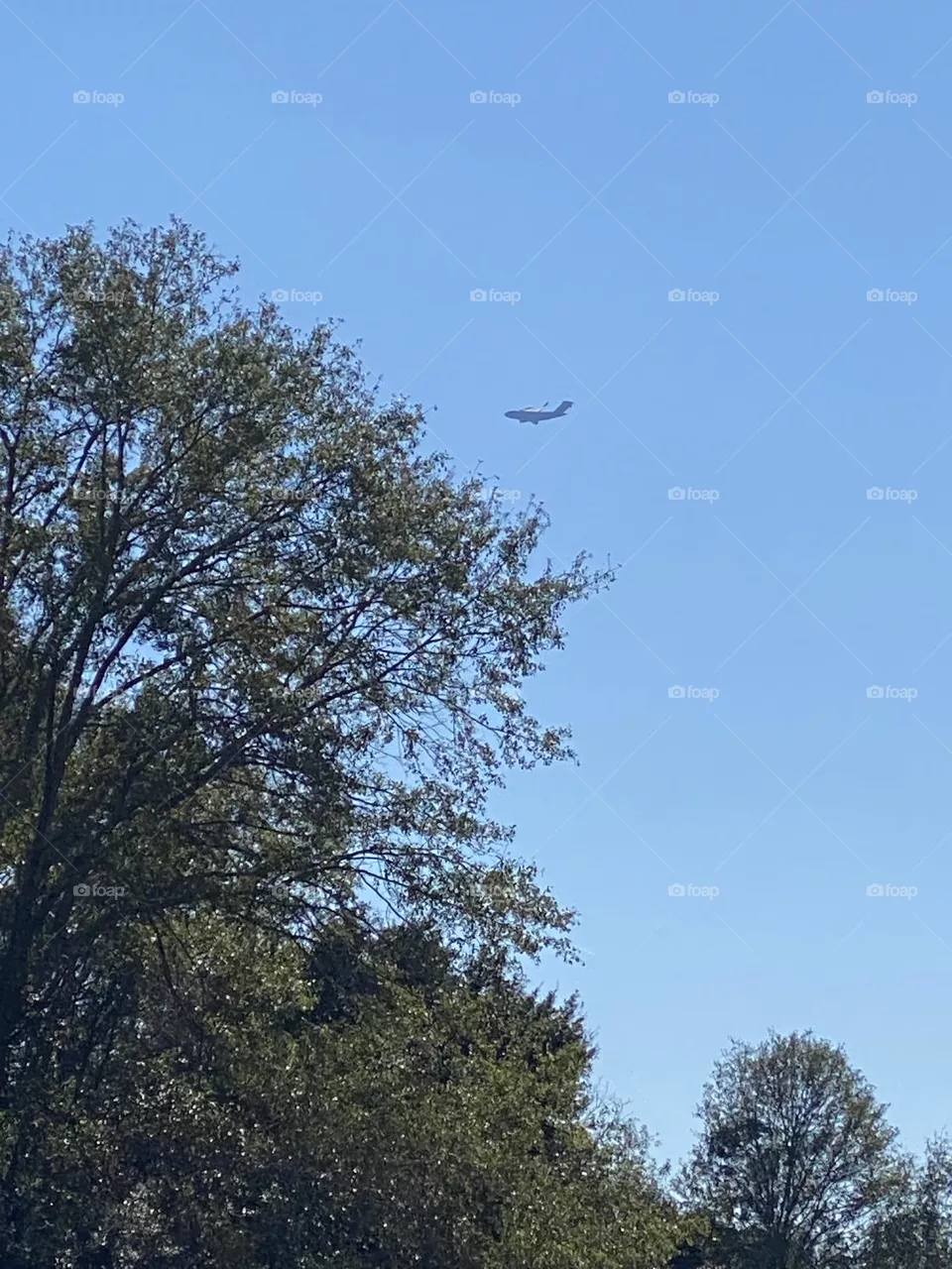 Blue sky with airplane flying bye 