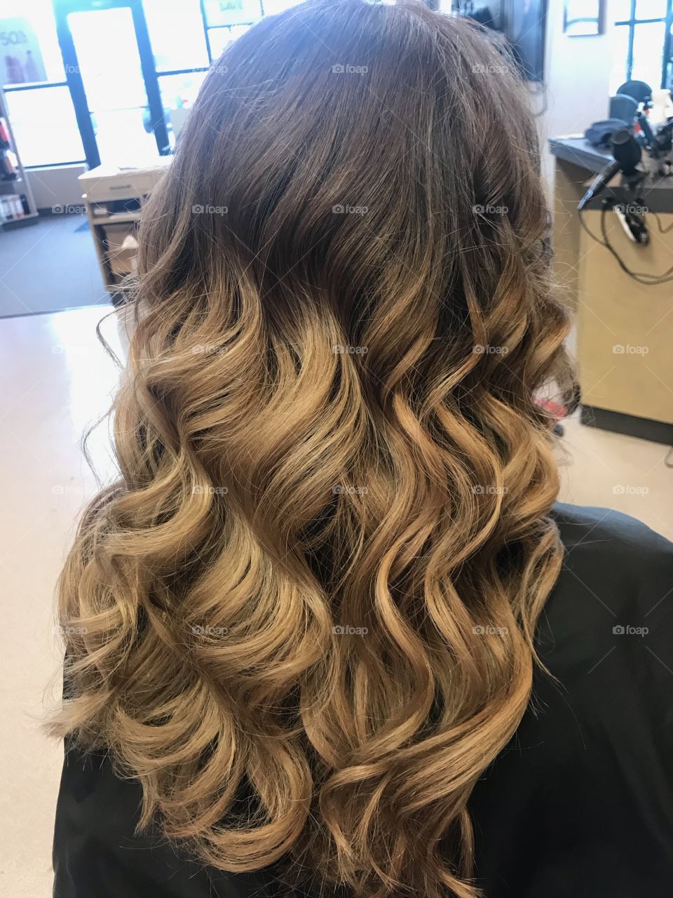 Hair styled in romantic waves 