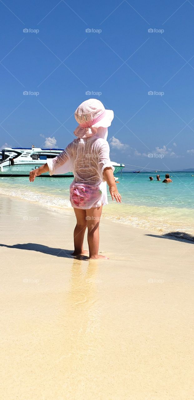 Little girl enjoying the beach