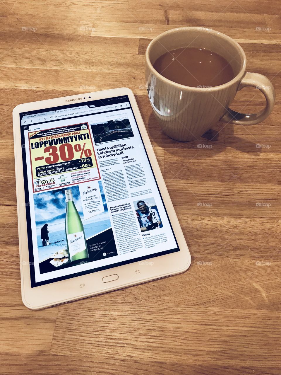 A digital newspaper and a cup of Coffee 