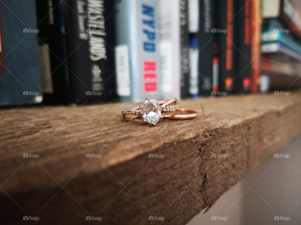 Wedding ring and books