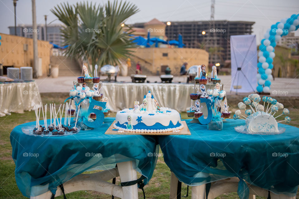 a candy table with a birthday cake