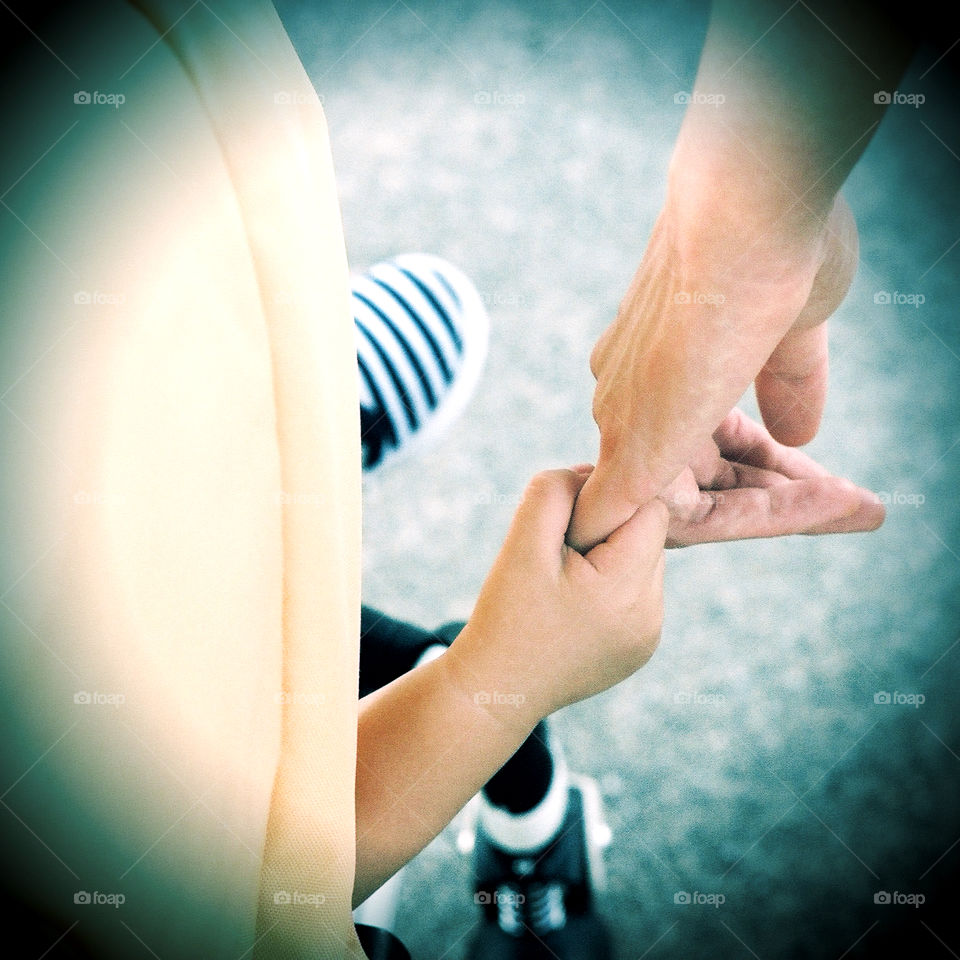 Baby and mother holding hands. Shot on fuji superia 200