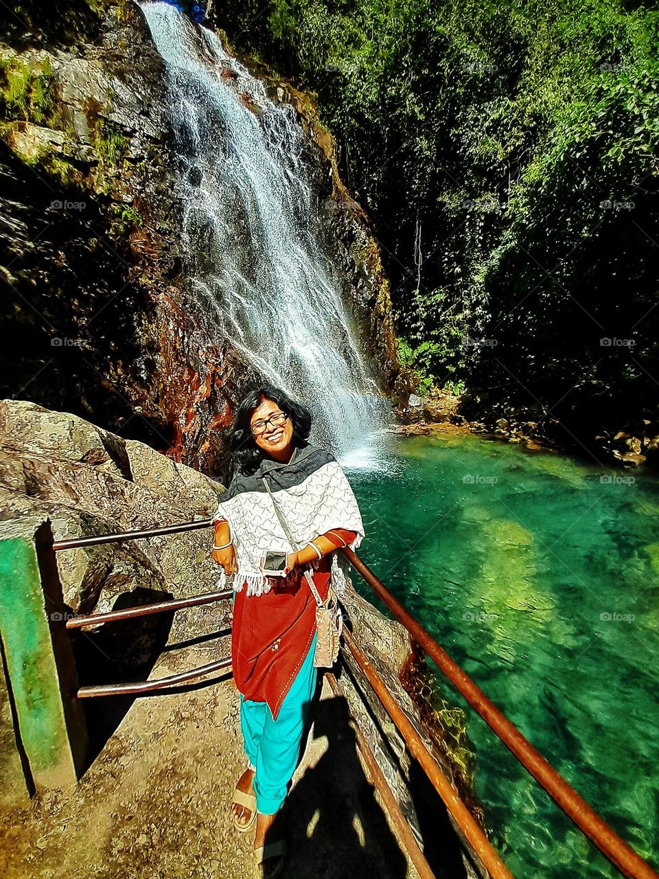 A pleasant happiness on the face. The environment makes her happy.
