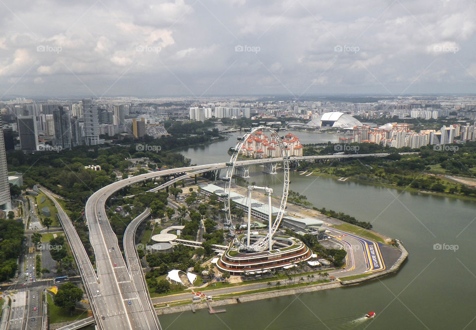 Big city with a ferris wheel, view from above