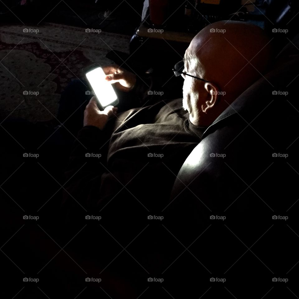 Cell Phone Lighting Face For Photograph

Took this picture and the only light needed was the light coming from the cell phone!