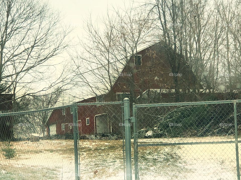 Barn behind fence