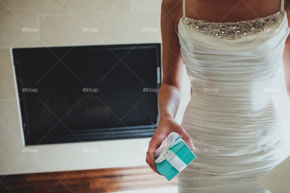 Bride holding gift box in hand
