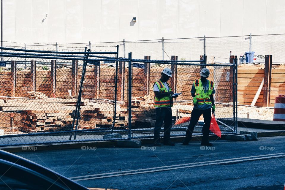 Two construction works planning at site