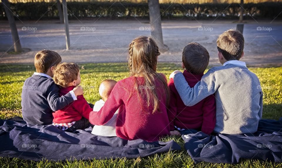 Group of children embraced in the park 