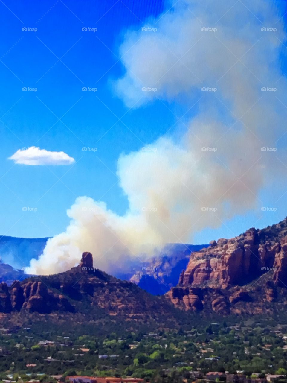 The smoke from an airplane crash just outside Sedona, Arizona. I was on a Jeep tour of the desert around the town, which had to be cut short. Two people died, and at the same time, I was meditating at one of the vortexes.