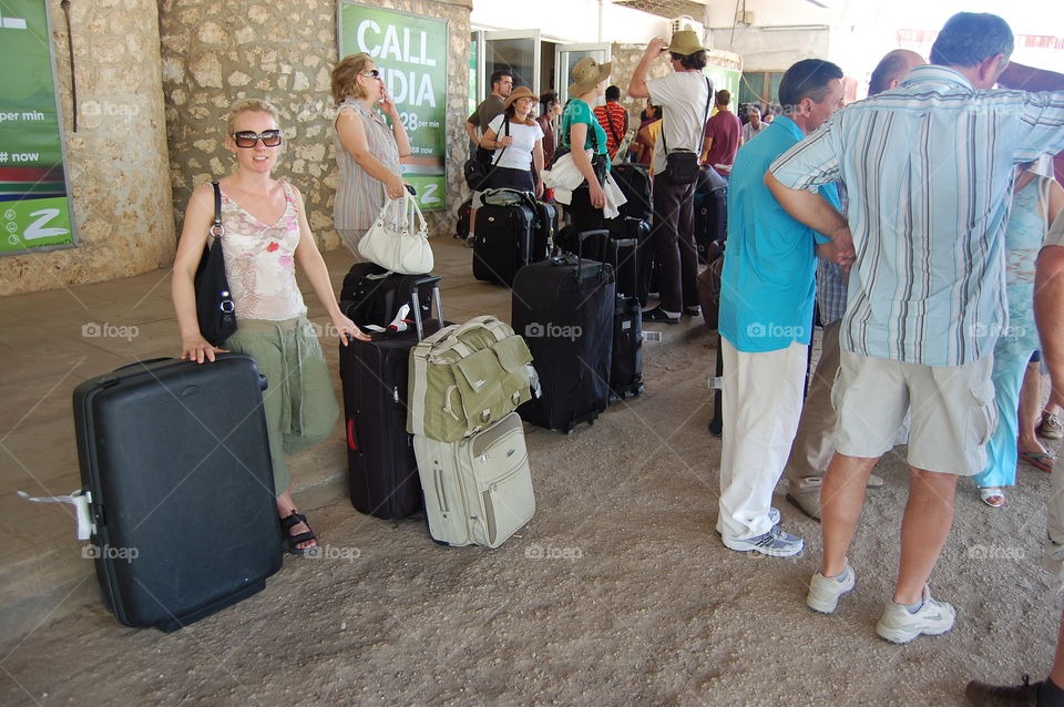 Tourists waiting for transport to hotel in Tanzania.